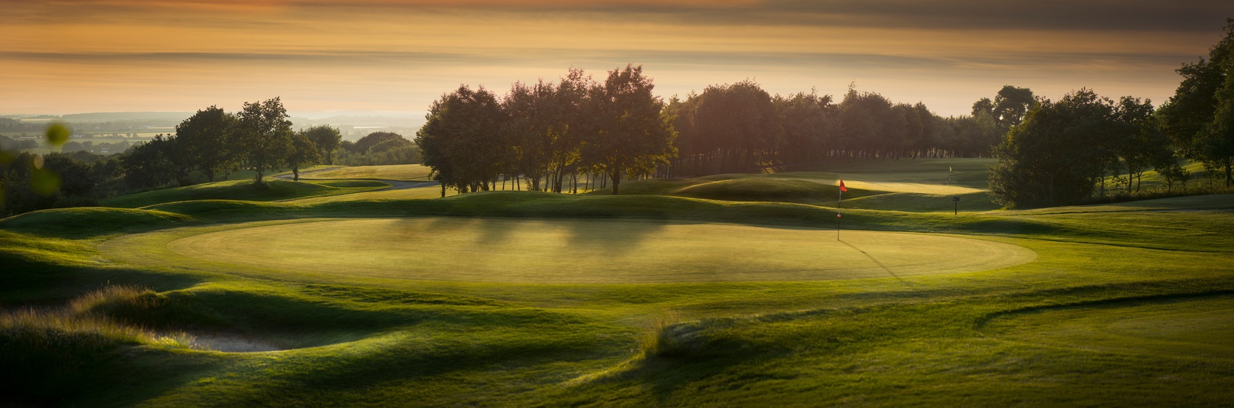 a panoramic scene of an empty golf course